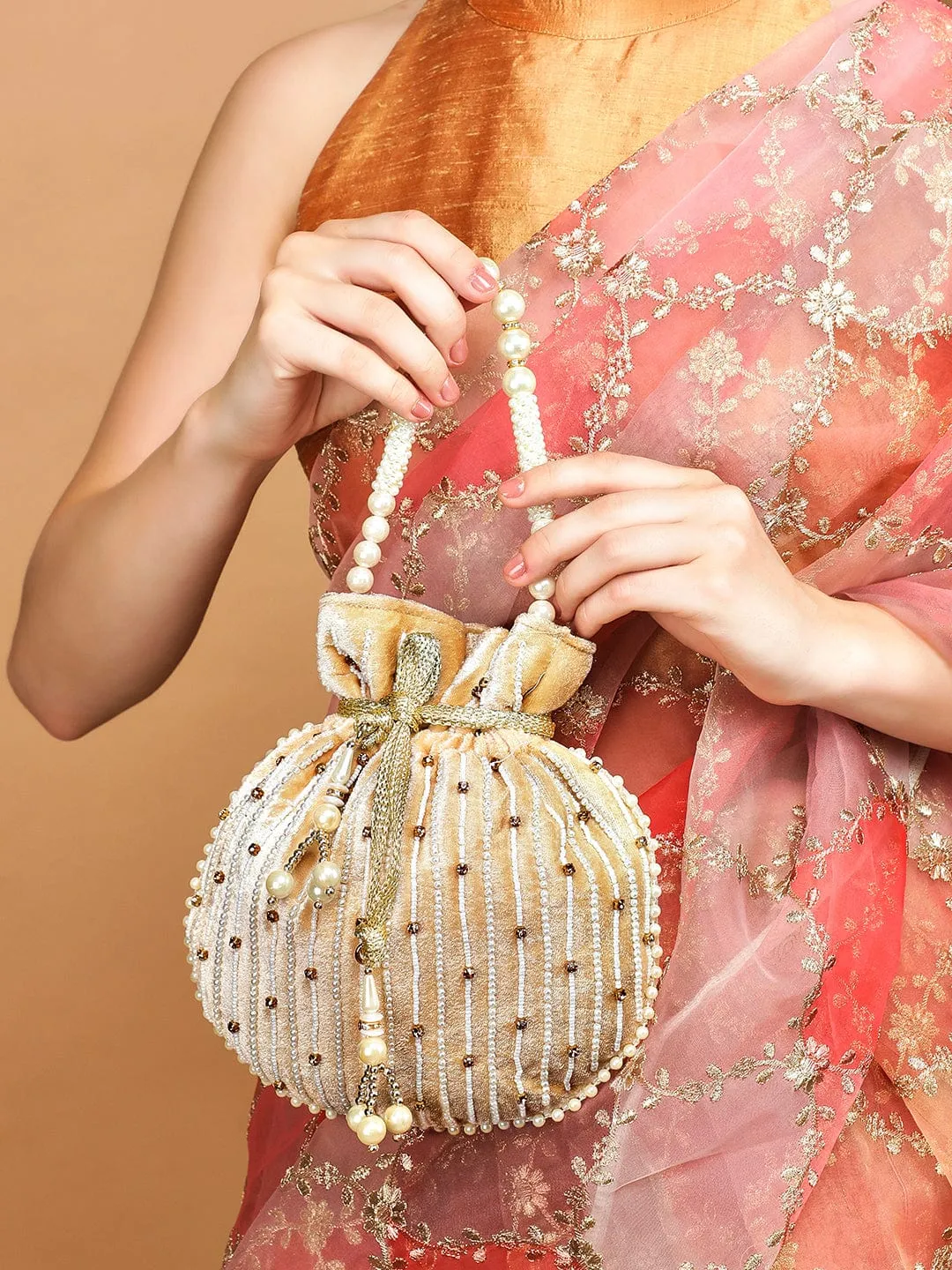 Rubans Cream Coloured Velvet Potli Bag With Pearls And Golden Beads